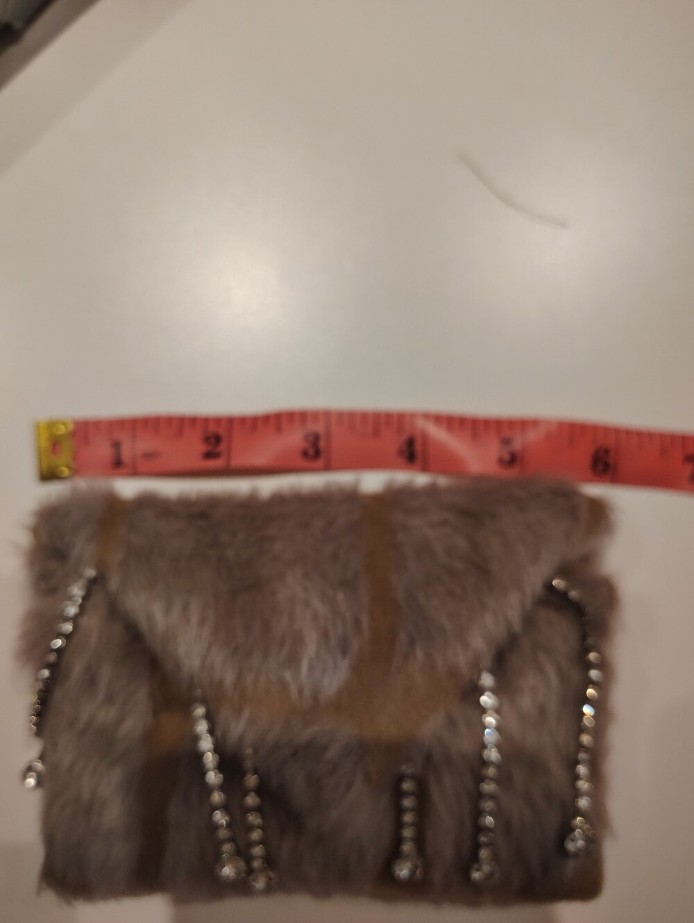 Faux Fur Chain-Embellished Clutch in Taupe